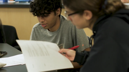 Two UC Riverside students studying together in class