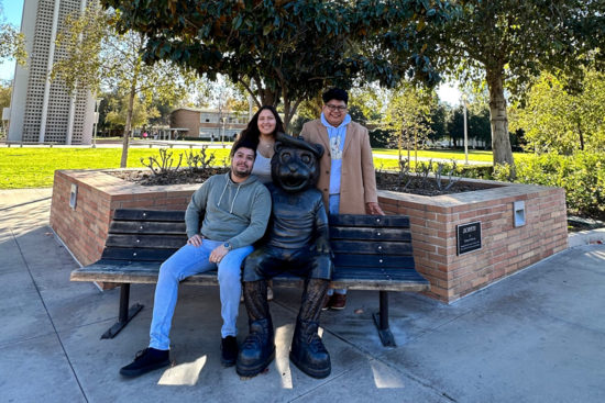 Students hanging out with Scotty statue